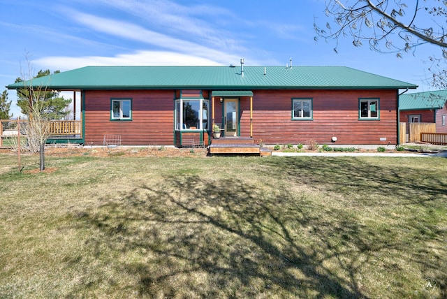 3570 Juniper Dr, Helena, MT 59602 - rear view of house with a yard, a wooden deck, and a metal roof