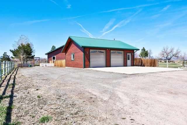 3570 Juniper Dr, Helena, MT 59602 - view of home's exterior with a garage, an outdoor structure, and a metal roof