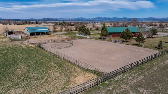 3570 Juniper Dr, Helena, MT 59602 - surrounding community with a view of rural / pastoral area, an outdoor riding arena, an exterior structure, and a mountain view