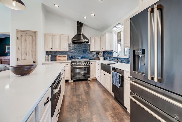 3570 Juniper Dr, Helena, MT 59602 - kitchen featuring high quality appliances, wall chimney range hood, lofted ceiling, light countertops, and decorative backsplash