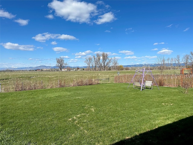 262 Birch Ln, Stevensville, MT 59870 - view of yard with a rural view, fence, and a mountain view