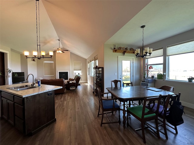 262 Birch Ln, Stevensville, MT 59870 - dining space featuring dark wood finished floors, lofted ceiling, baseboards, and ceiling fan with notable chandelier