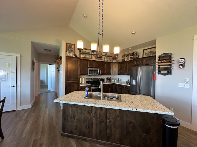 262 Birch Ln, Stevensville, MT 59870 - kitchen featuring dark brown cabinets, a sink, pendant lighting, stainless steel appliances, and dark wood finished floors