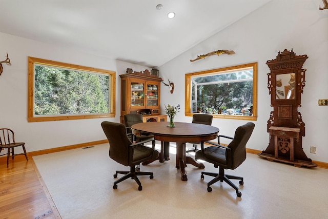 1000 Kelley Rd, Columbia Falls, MT 59912 - dining area with vaulted ceiling, baseboards, recessed lighting, and wood finished floors