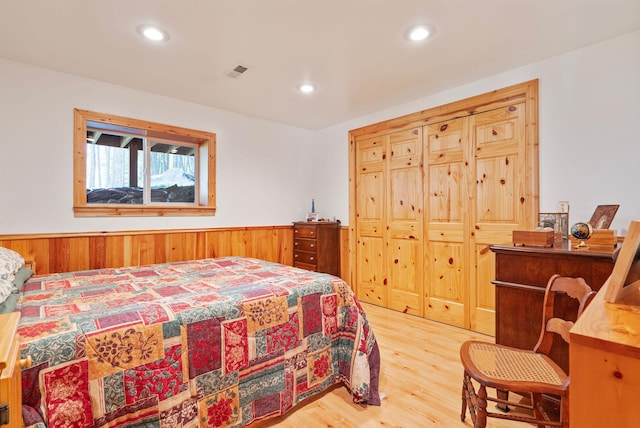 1000 Kelley Rd, Columbia Falls, MT 59912 - bedroom with wood finished floors, wainscoting, recessed lighting, and wooden walls