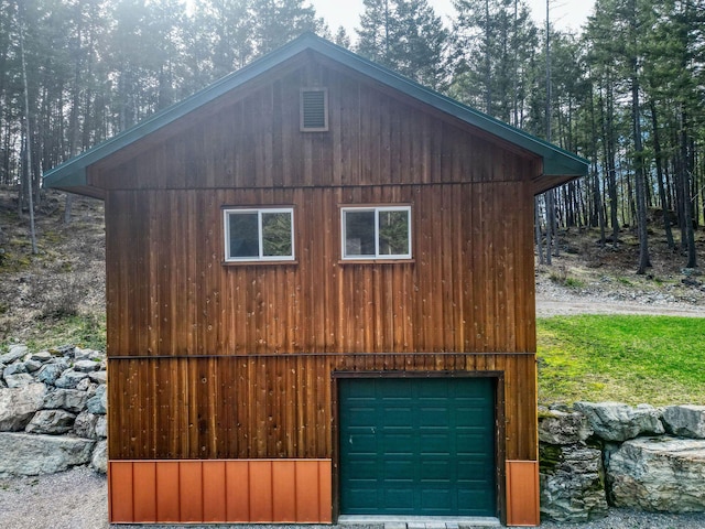 1000 Kelley Rd, Columbia Falls, MT 59912 - garage featuring a garage and a forest view