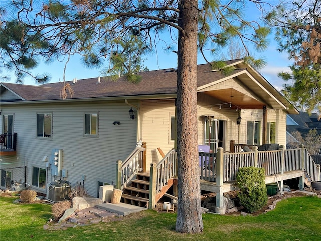 1023 Whitaker Dr Unit A, Missoula, MT 59803 - rear view of house featuring a yard, a deck, and roof with shingles
