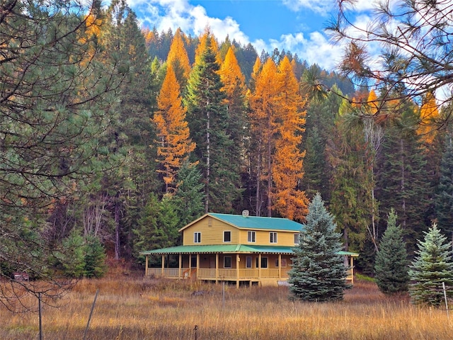 225 Marten Creek Rd, Trout Creek, MT 59874 - rear view of property with a view of trees, a chimney, and a metal roof