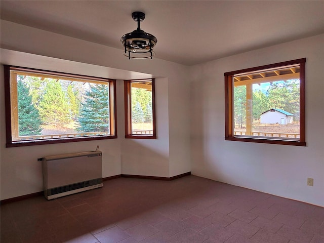 225 Marten Creek Rd, Trout Creek, MT 59874 - unfurnished room featuring radiator and healthy amount of natural light