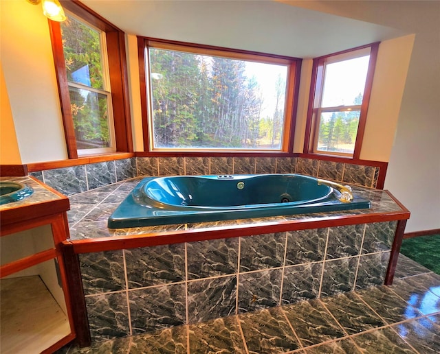 225 Marten Creek Rd, Trout Creek, MT 59874 - full bathroom with a whirlpool tub, marble look tile flooring, and vanity