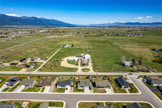 birds eye view of property featuring a mountain view and a rural view