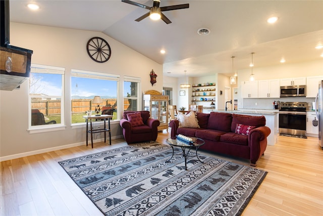 276 Tenderfoot Ln, Stevensville, MT 59870 - living room featuring ceiling fan, light wood finished floors, recessed lighting, baseboards, and high vaulted ceiling