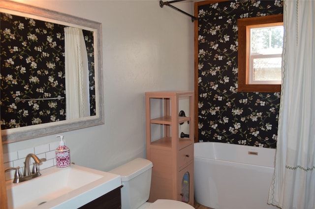 113 Cougar Trl, Whitefish, MT 59937 - full bath with a tub to relax in, wallpapered walls, toilet, and vanity