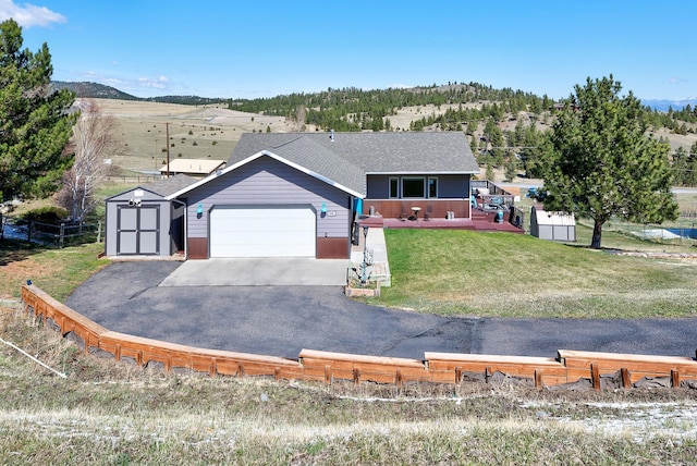 24 Hilltop Dr, Clancy, MT 59634 - single story home featuring a garage, a shed, driveway, and roof with shingles
