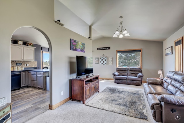 24 Hilltop Dr, Clancy, MT 59634 - living room with light carpet, lofted ceiling, a chandelier, and arched walkways