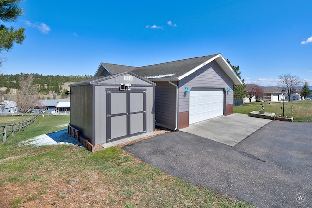 24 Hilltop Dr, Clancy, MT 59634 - detached garage featuring a shed