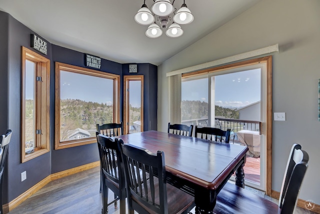 24 Hilltop Dr, Clancy, MT 59634 - dining space featuring a chandelier, wood finished floors, and vaulted ceiling