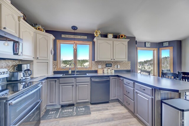 24 Hilltop Dr, Clancy, MT 59634 - kitchen featuring appliances with stainless steel finishes, a peninsula, gray cabinetry, and healthy amount of natural light
