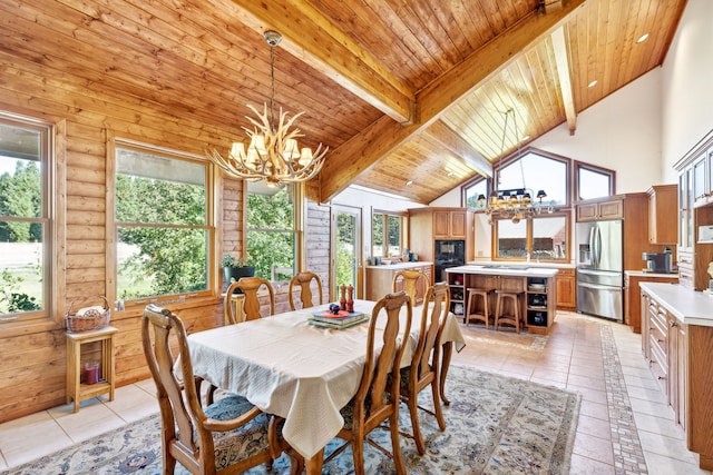 2549 Horseshoe Hills Trl, Seeley Lake, MT 59868 - dining area with a chandelier, plenty of natural light, a wooden ceiling with exposed beams, high vaulted ceiling, and light tile patterned floors