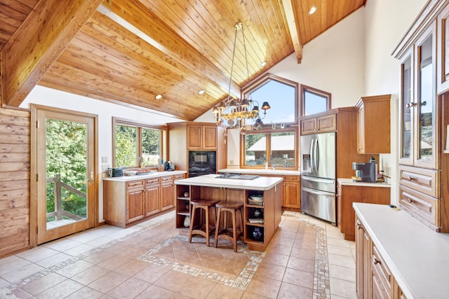 2549 Horseshoe Hills Trl, Seeley Lake, MT 59868 - kitchen featuring stainless steel refrigerator with ice dispenser, open shelves, light countertops, a center island, and a wooden ceiling with exposed beams