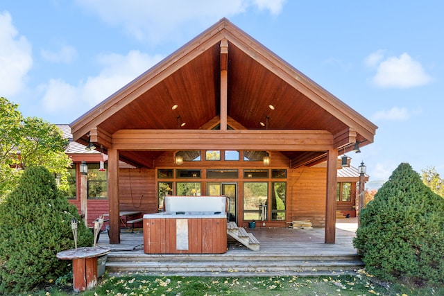 2549 Horseshoe Hills Trl, Seeley Lake, MT 59868 - back of house featuring a hot tub and a wooden deck