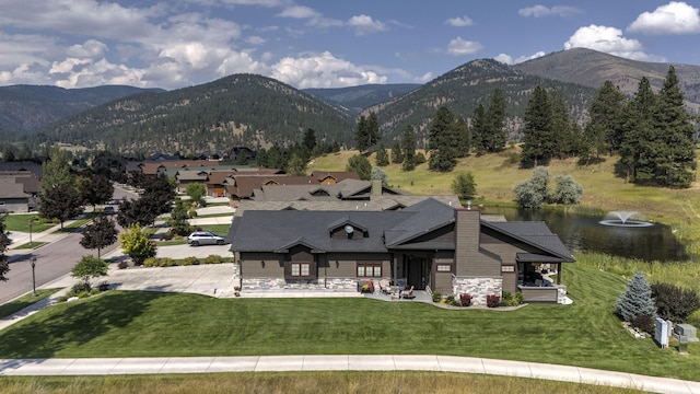 780 Anglers Bend Way, Missoula, MT 59802 - exterior space with a yard, stone siding, and a water and mountain view