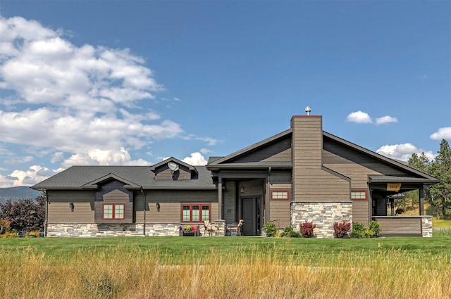 780 Anglers Bend Way, Missoula, MT 59802 - view of front of home featuring stone siding, a chimney, and a front yard