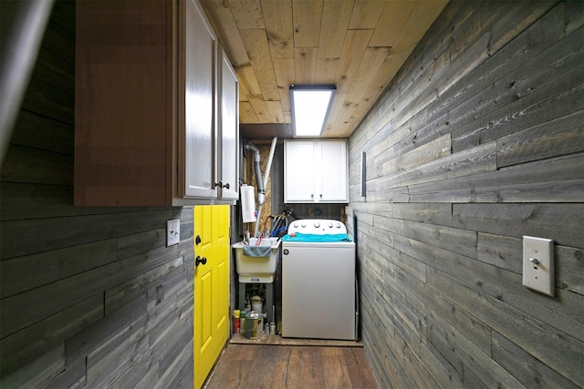 utilities featuring a sink and washer / dryer