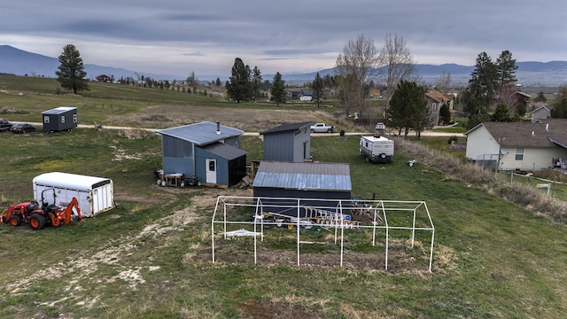 bird's eye view with a rural view and a mountain view