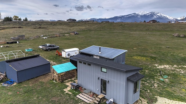 exterior space with a rural view and a mountain view
