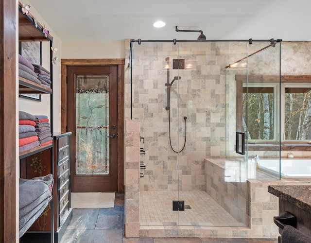 675 Beaver Lake Rd, Whitefish, MT 59937 - bathroom featuring a shower stall, recessed lighting, and stone finish floors