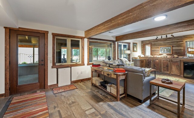 675 Beaver Lake Rd, Whitefish, MT 59937 - living room with wood finished floors, beam ceiling, and wood walls