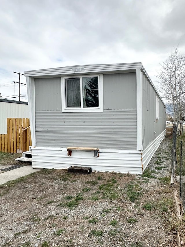 view of property exterior featuring fence