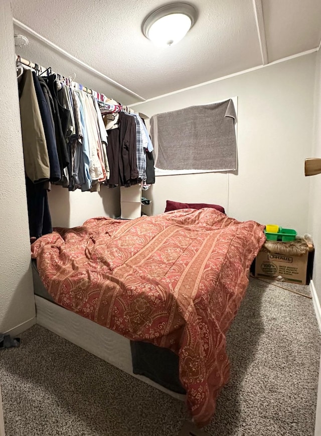 bedroom featuring baseboards and carpet flooring
