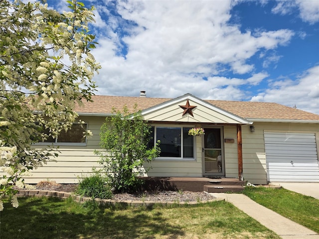 2225 N Dr, Butte, MT 59701 - view of front of home featuring a garage, concrete driveway, a front yard, and roof with shingles