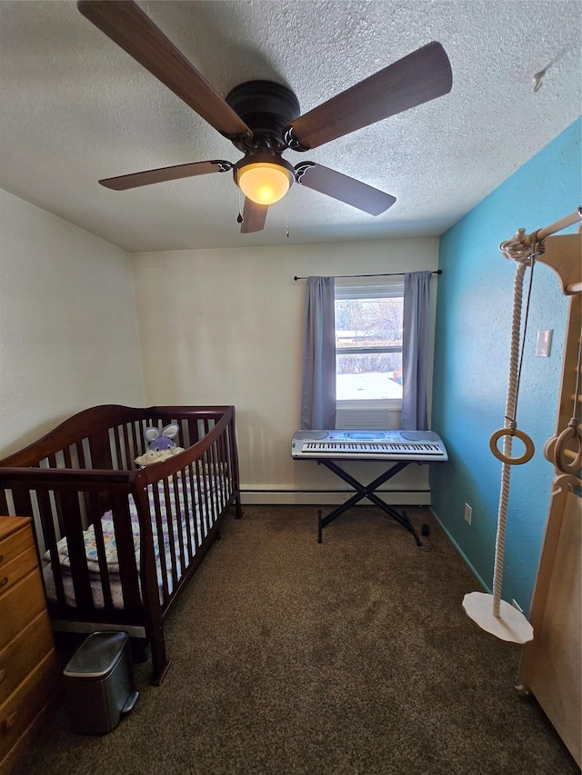 carpeted bedroom featuring ceiling fan, baseboards, a textured ceiling, and a baseboard radiator