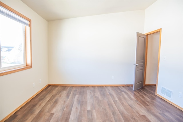 2226 Burlington Ave Unit A, Missoula, MT 59801 - spare room featuring visible vents, baseboards, and wood finished floors