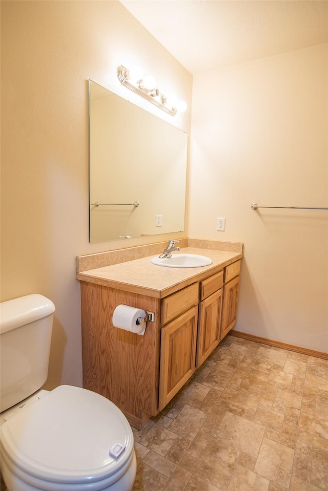 2226 Burlington Ave Unit A, Missoula, MT 59801 - half bathroom with vanity, toilet, and stone finish flooring