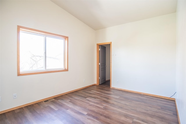 2226 Burlington Ave Unit A, Missoula, MT 59801 - empty room featuring baseboards, visible vents, wood finished floors, and lofted ceiling