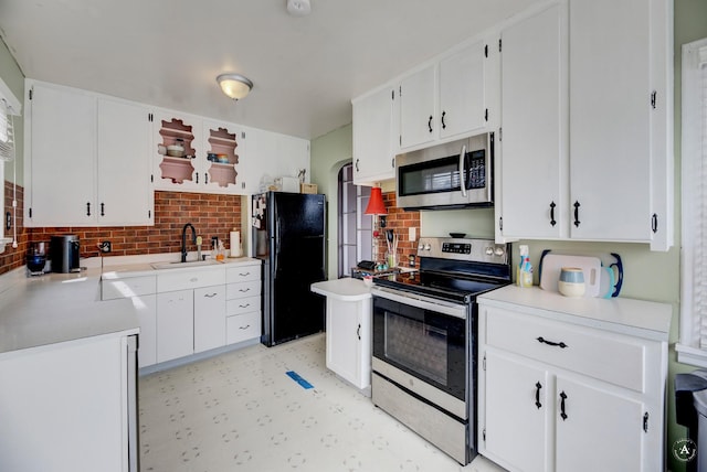 730 N Montana Ave, Helena, MT 59601 - kitchen with stainless steel appliances, light floors, backsplash, light countertops, and a sink
