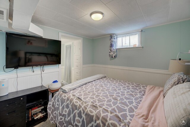 730 N Montana Ave, Helena, MT 59601 - bedroom with a wainscoted wall and crown molding