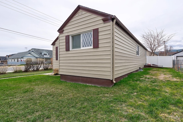 730 N Montana Ave, Helena, MT 59601 - view of home's exterior featuring fence and a lawn