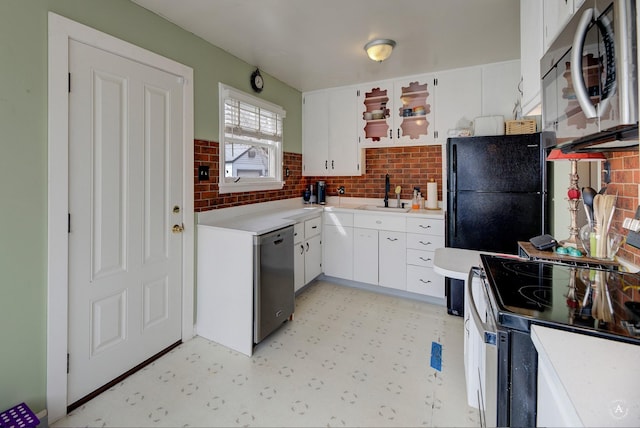 730 N Montana Ave, Helena, MT 59601 - kitchen featuring a sink, white cabinetry, light floors, light countertops, and black appliances