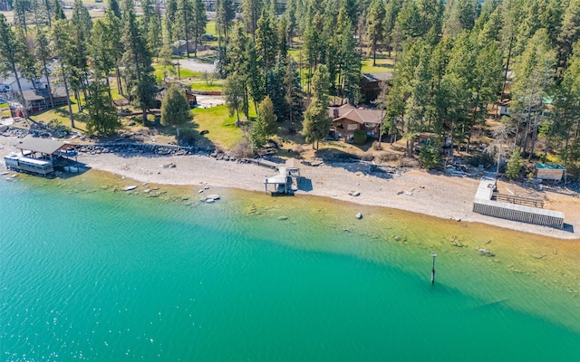 drone / aerial view featuring a view of the beach and a water view