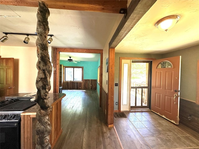 foyer entrance featuring baseboards, hardwood / wood-style flooring, and ceiling fan