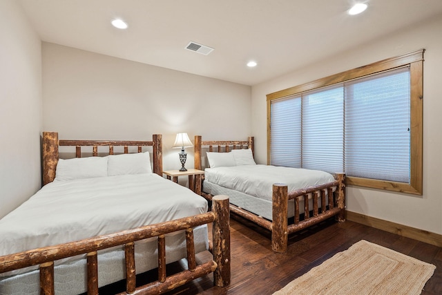 105 Oliver Ln Unit 7, Bigfork, MT 59911 - bedroom with wood finished floors and recessed lighting