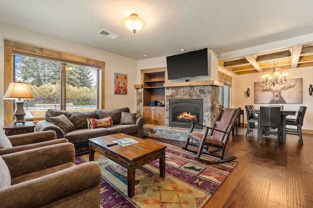 105 Oliver Ln Unit 7, Bigfork, MT 59911 - living room featuring a chandelier, dark wood-type flooring, coffered ceiling, a fireplace, and beamed ceiling