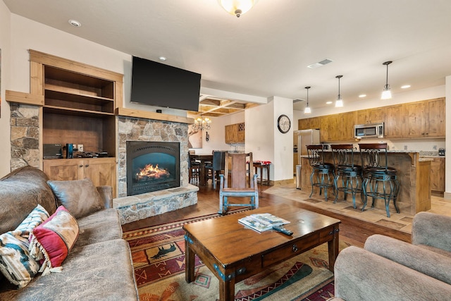 105 Oliver Ln Unit 7, Bigfork, MT 59911 - living room with recessed lighting, light wood finished floors, and a fireplace