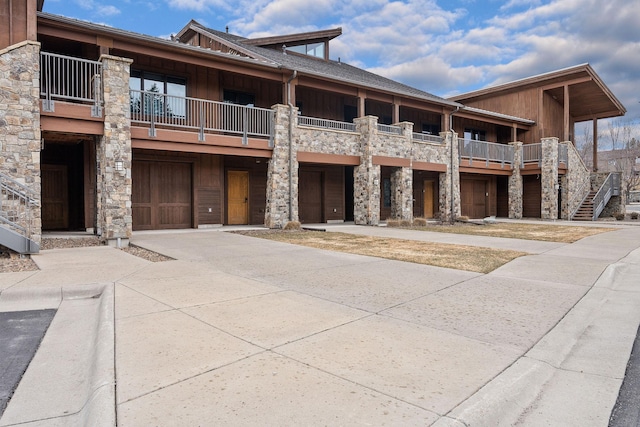 105 Oliver Ln Unit 7, Bigfork, MT 59911 - view of building exterior with concrete driveway and an attached garage