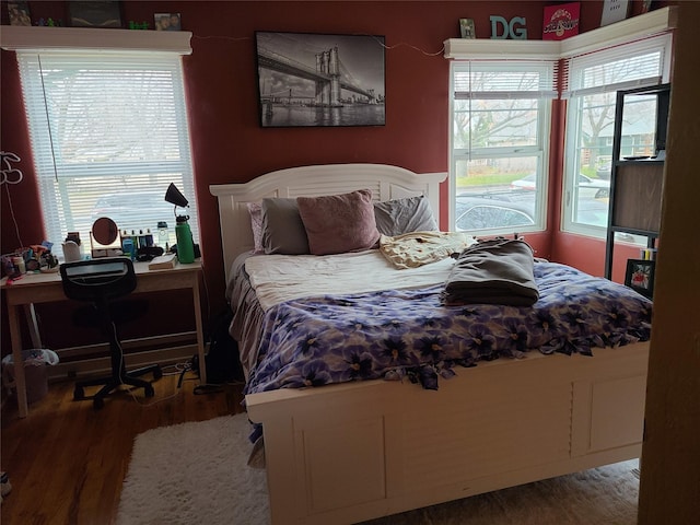 bedroom featuring wooden walls, a brick fireplace, and carpet floors